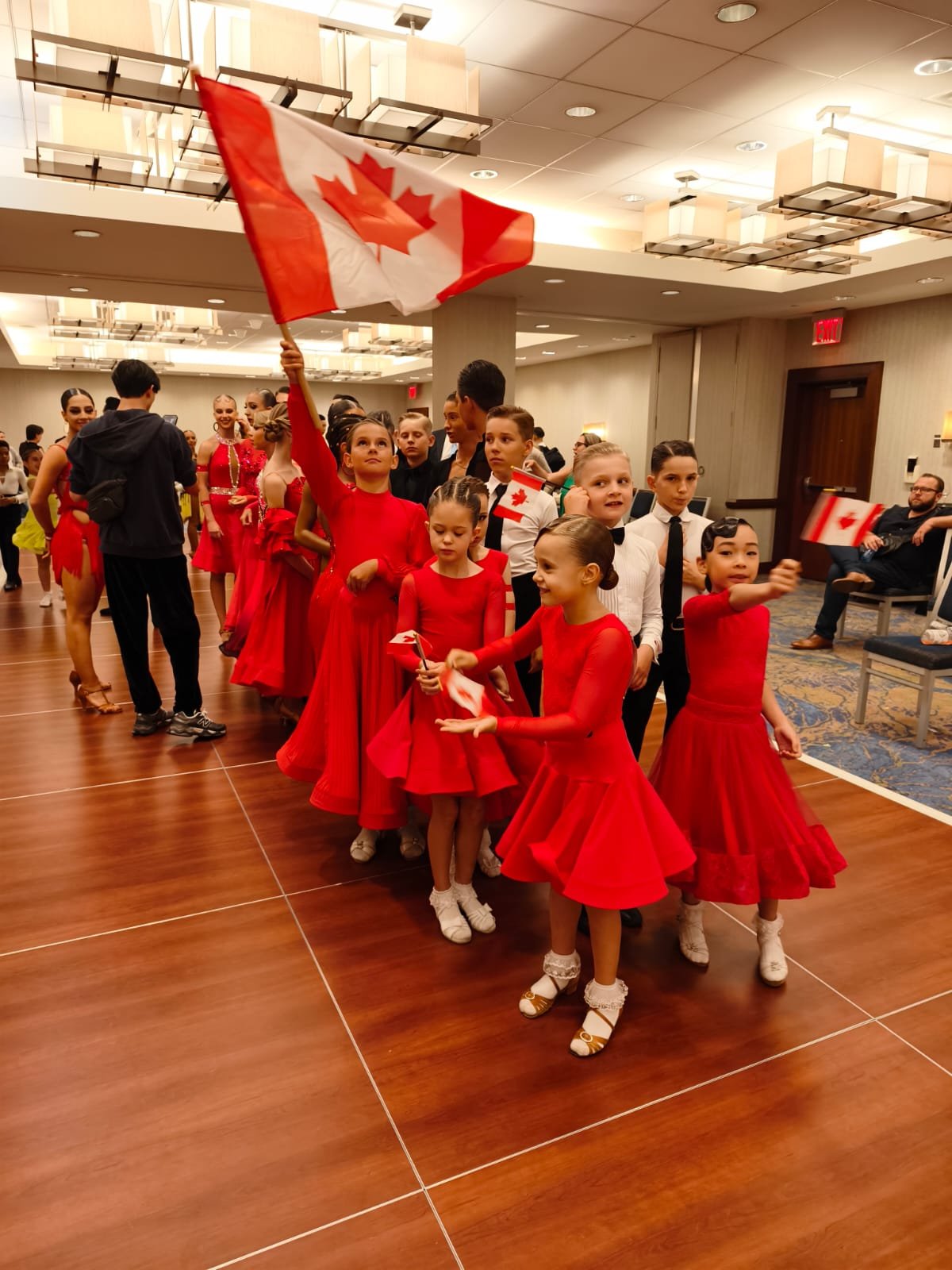 Universe DanceArt dancers with Team Canada flag